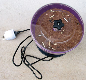 Graf Vibratory Tumbler with cases inside