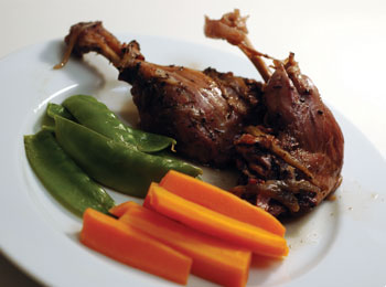 Ladle the gravy over the duck, garnish with sprigs of parsley and serve with mixed steamed vegetables and a glass of a red wine.