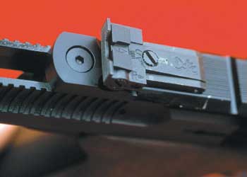 The Buck Mark’s rear sight is fully click adjustable for windage and elevation. The grooves in the top rib are designed to accommodate Weaver-type scope mounts.