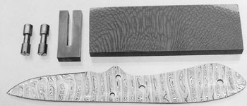 Hunting knife blank fashioned from Damasteel (Swedish stainless Damascus) ready for the grip and guard to be fitted.