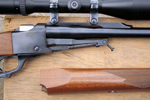 The fore-end on Ruger rifles is attached by this hanger arrangement under the barrel. Notice the angled screw that pulls the fore-end up against the barrel and into the front of the receiver at the same time.