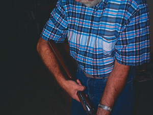 By placing the shotgun butt stock against your forearm in this manner it will tell you roughly if the stock is the right length for you.